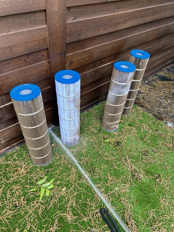 Pool filters being rinsed during cleaning