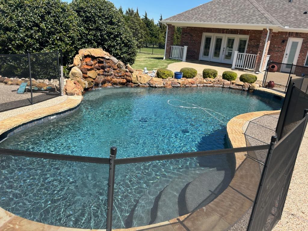 Clean residential swimming pool serviced by AM Pool Service